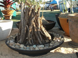 large fire pit, black scoria lava stone finish, steel base supports